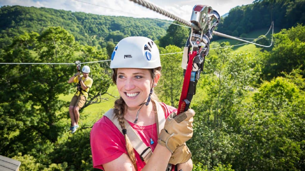 All Smiles After the Final Zip on High Gravity Adventures' Zip Line Tour high-gravity-adventures-boone-zipline-girl-smiling-landing