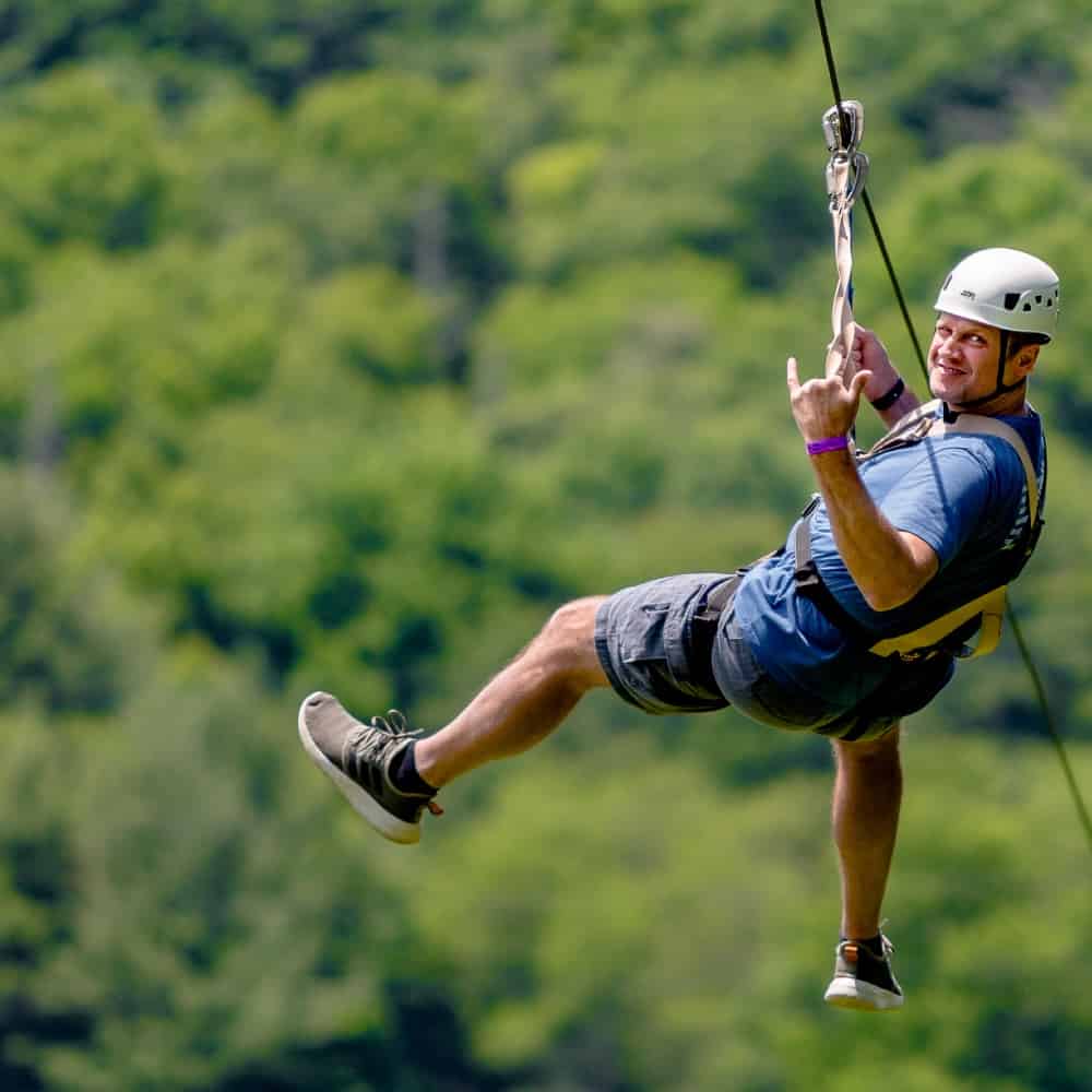 Man riding zip line at HGA