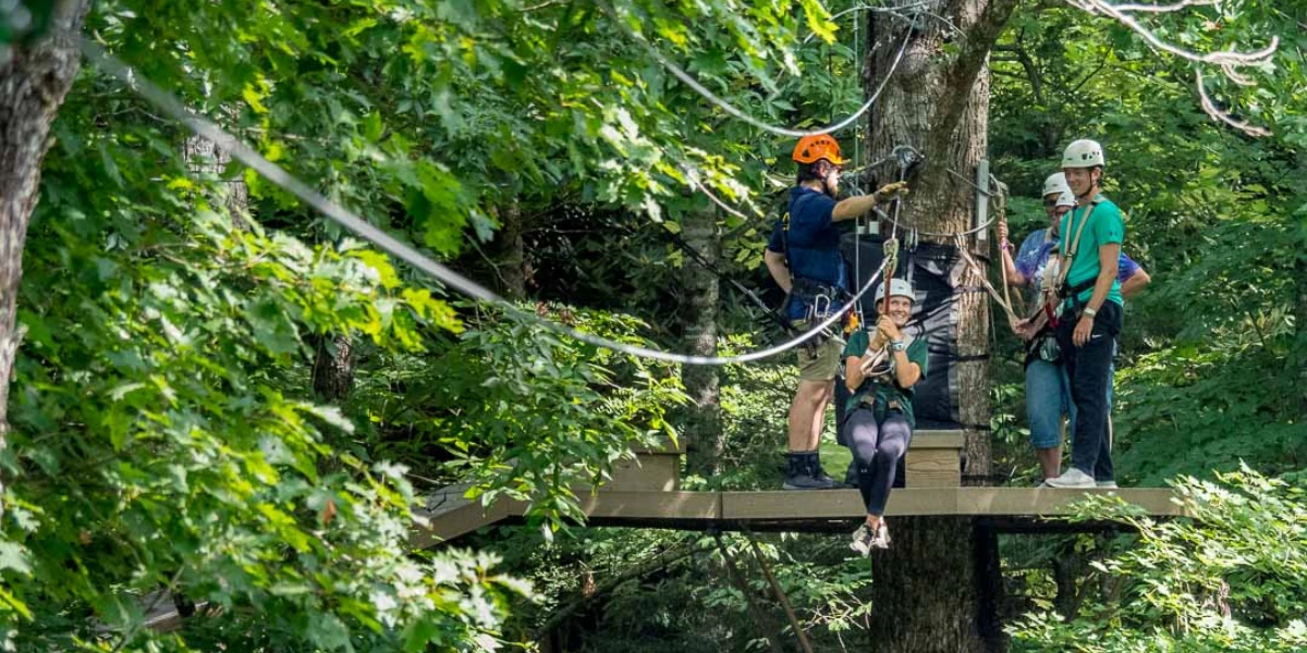 group of people zip lining
