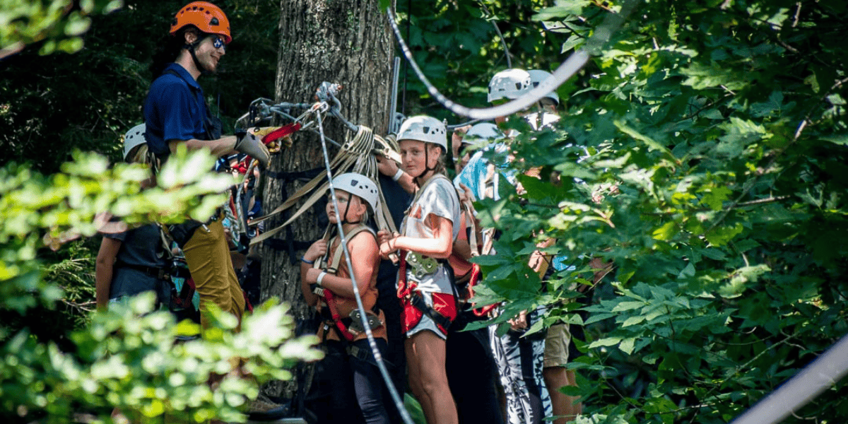 group of kids getting ready to go ziplining