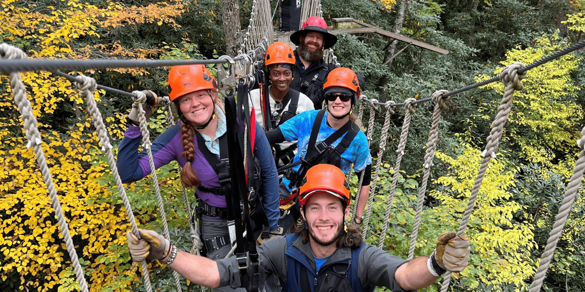 group on high ropes course in the rain
