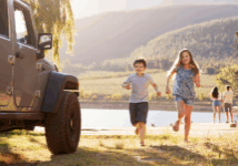 two kids running back to their family vehicle