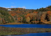 lake with colorful trees surrounding