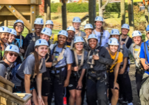 A group of people at an outdoor team building activity